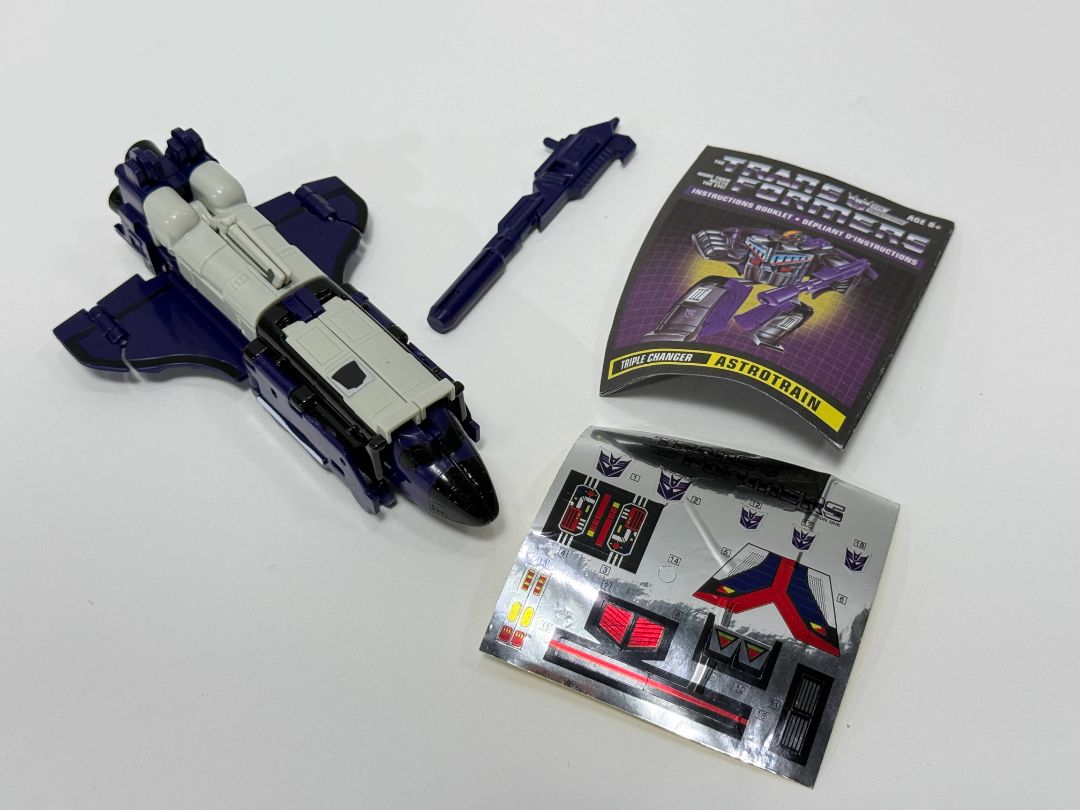 Transformers G1 Commemorative Series – Astrotrain (Metal Body, Triple Changer, Manual & Stickers)